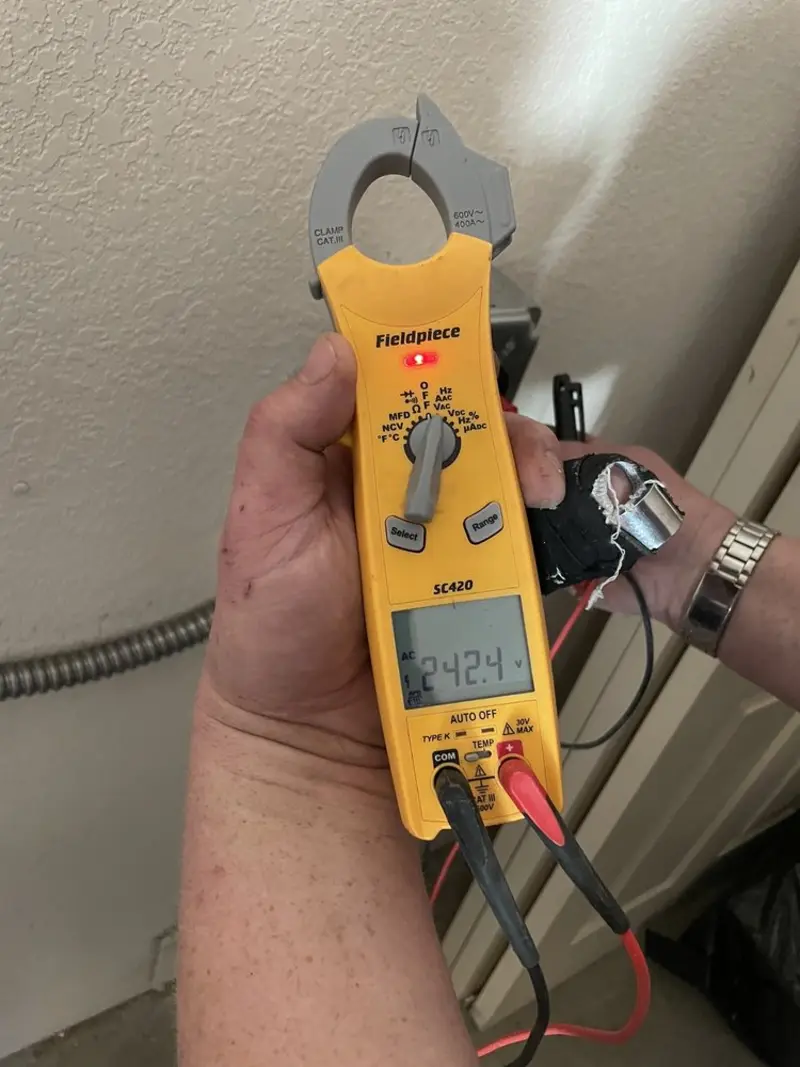 Voltage testing with clamp meter during Ceiling Fan Installation in Iuka